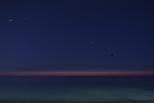 Blue twilight settling over a dark horizon
